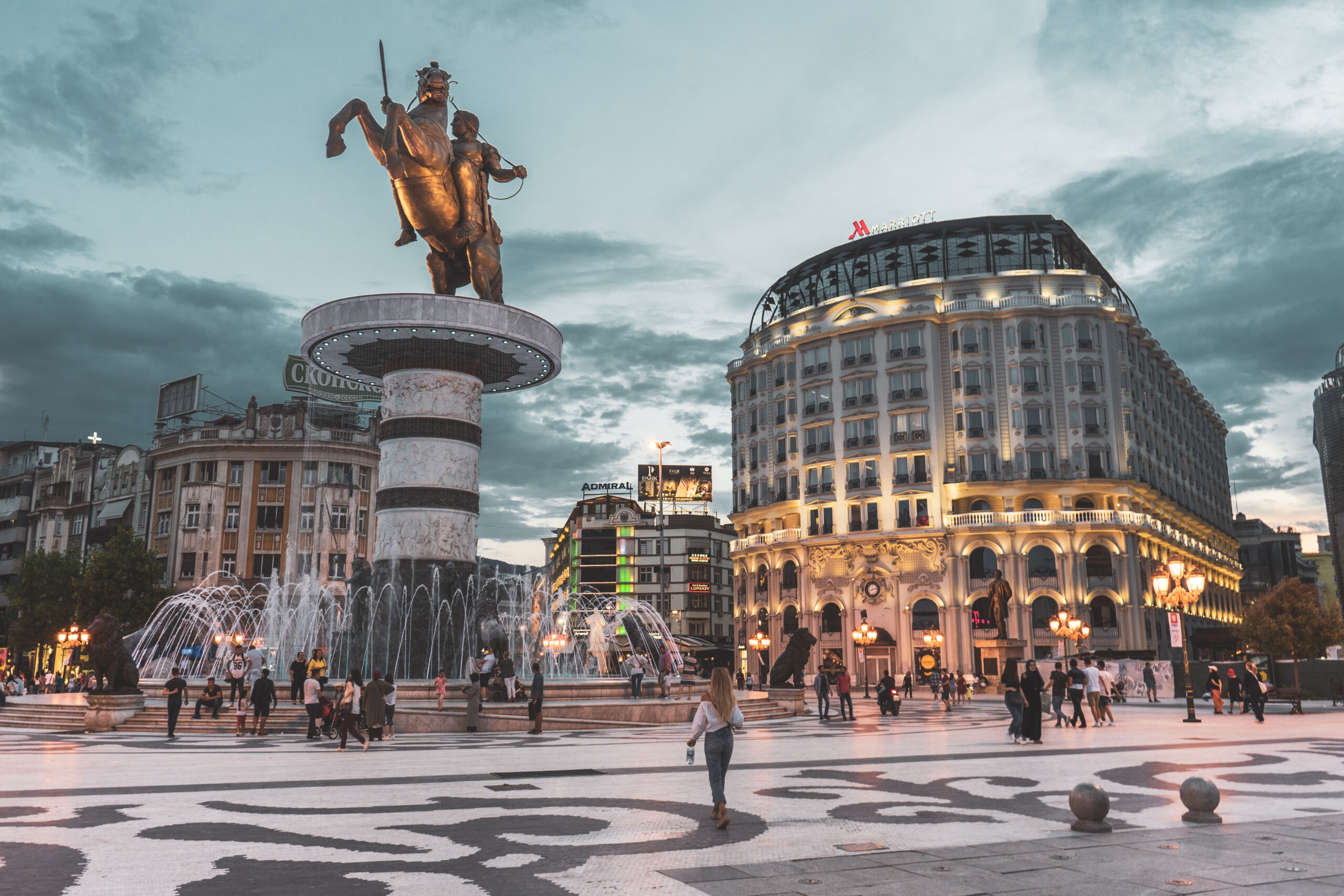 Macedonia Square in Skopje, featuring the statue of Alexander the Great and the Marriott Hotel in the background.