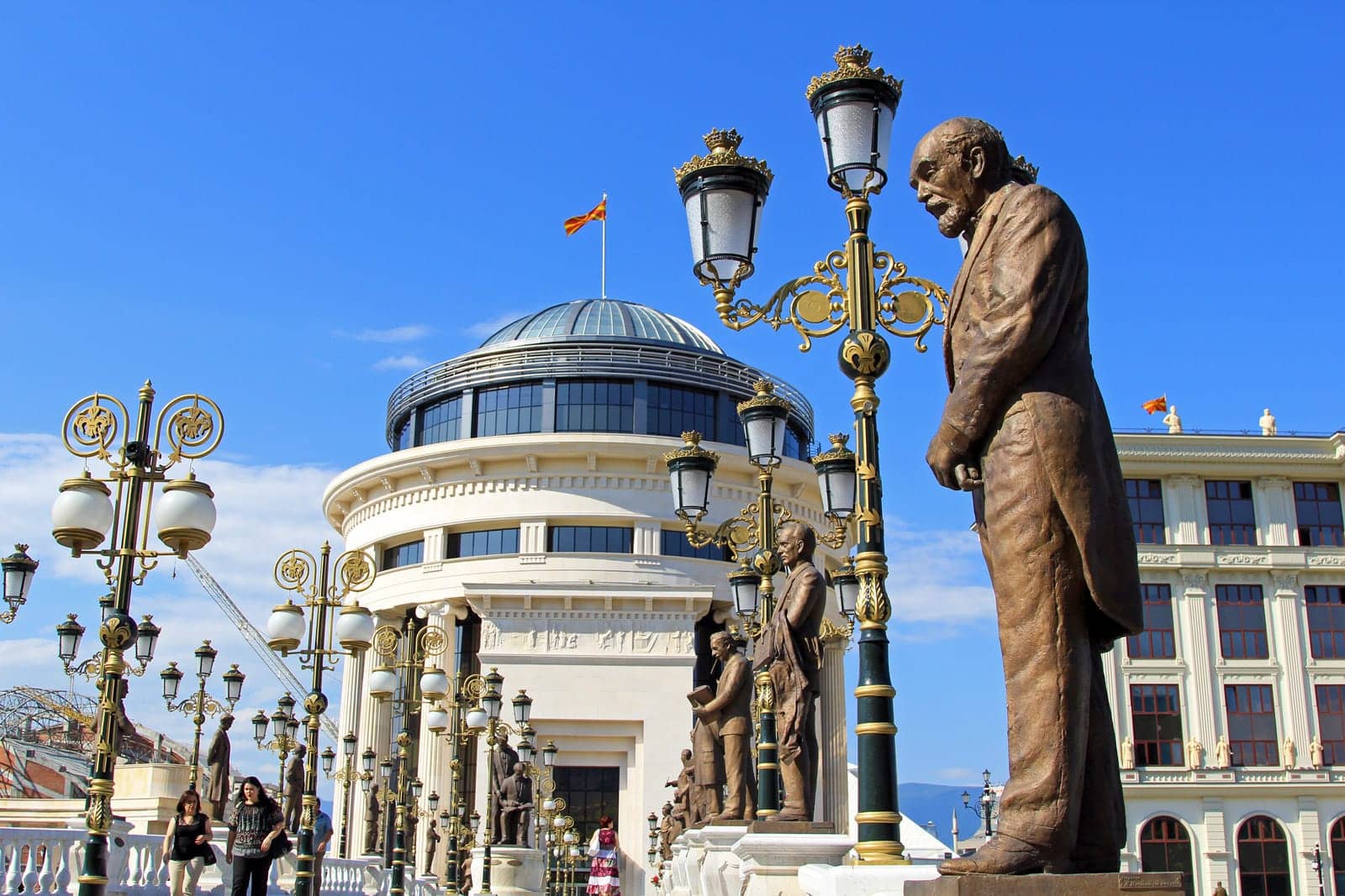 The Art Bridge in Skopje, decorated with statues and ornate lamps near the Museum of Macedonia.