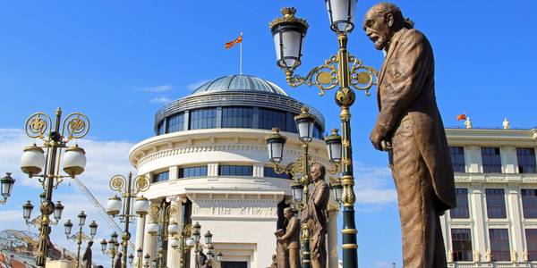 The Art Bridge in Skopje, decorated with statues and ornate lamps near the Museum of Macedonia.