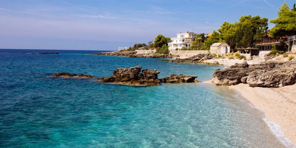 Dhërmi Beach, a gem of the Albanian Riviera with crystal-clear waters and breathtaking landscapes.