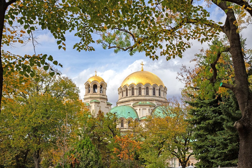 A cathedral in Sofia with autumn leaves.