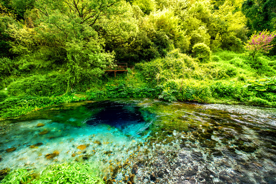 The Blue Eye, a mesmerizing natural spring with crystal-clear blue water and mysterious depth.