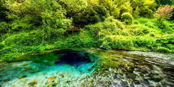 The Blue Eye, a mesmerizing natural spring with crystal-clear blue water and mysterious depth.