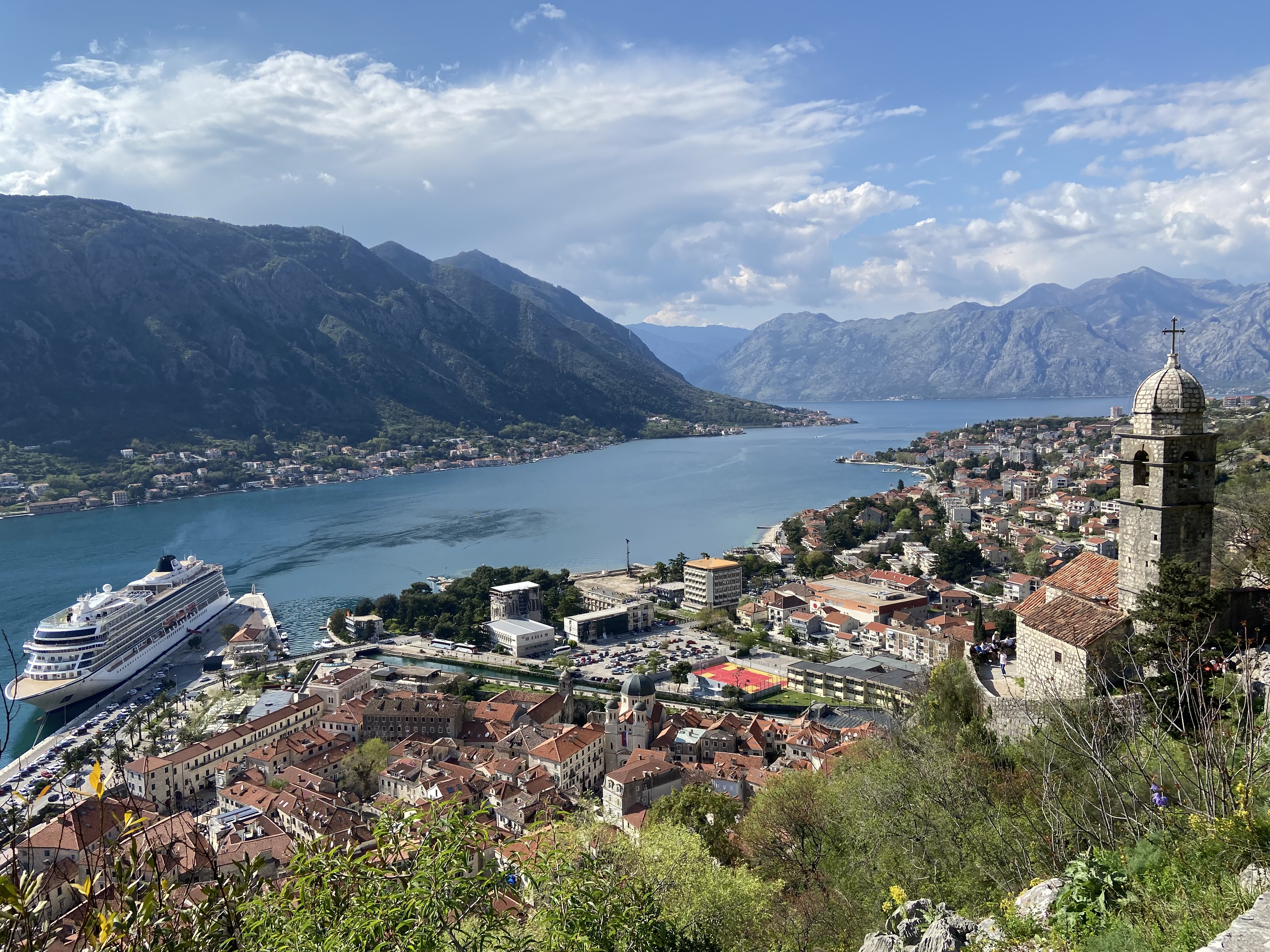 A stunning view of Kotor’s old town, red-roofed houses, and the deep blue bay. A perfect spot to see the city’s charm from above.