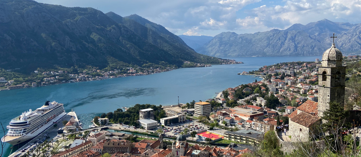 A stunning view of Kotor’s old town, red-roofed houses, and the deep blue bay. A perfect spot to see the city’s charm from above.