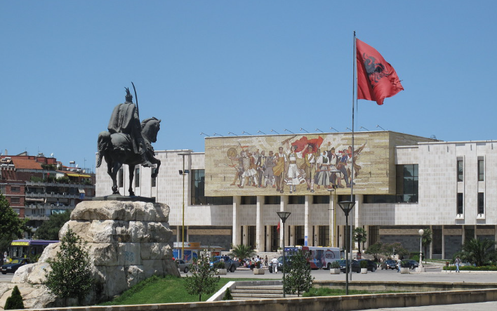 The main square of Tirana, surrounded by important buildings and a statue of Skanderbeg in the center.