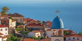 Dhërmi village with its iconic church and stunning views of the Ionian Sea.